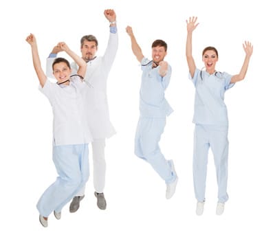 image happy doctors jumping for joy