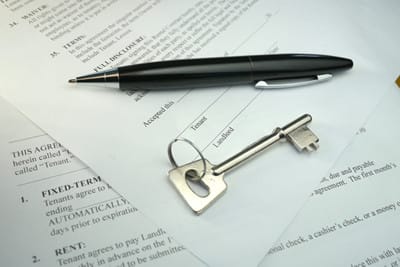 image pen and key lying on lease