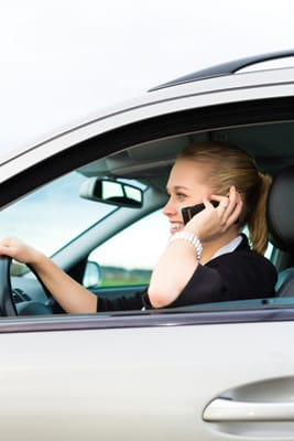 image woman driving and talking on phone