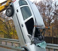 Car flips over and lands vertically – drunk driver gets out singing, wearing only underwear