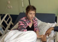 Two Polish children about to smile for the first time with facial surgery