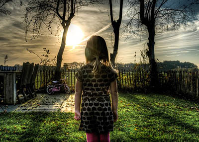 image girl looks over backyard